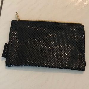 Makeup bag or purse.